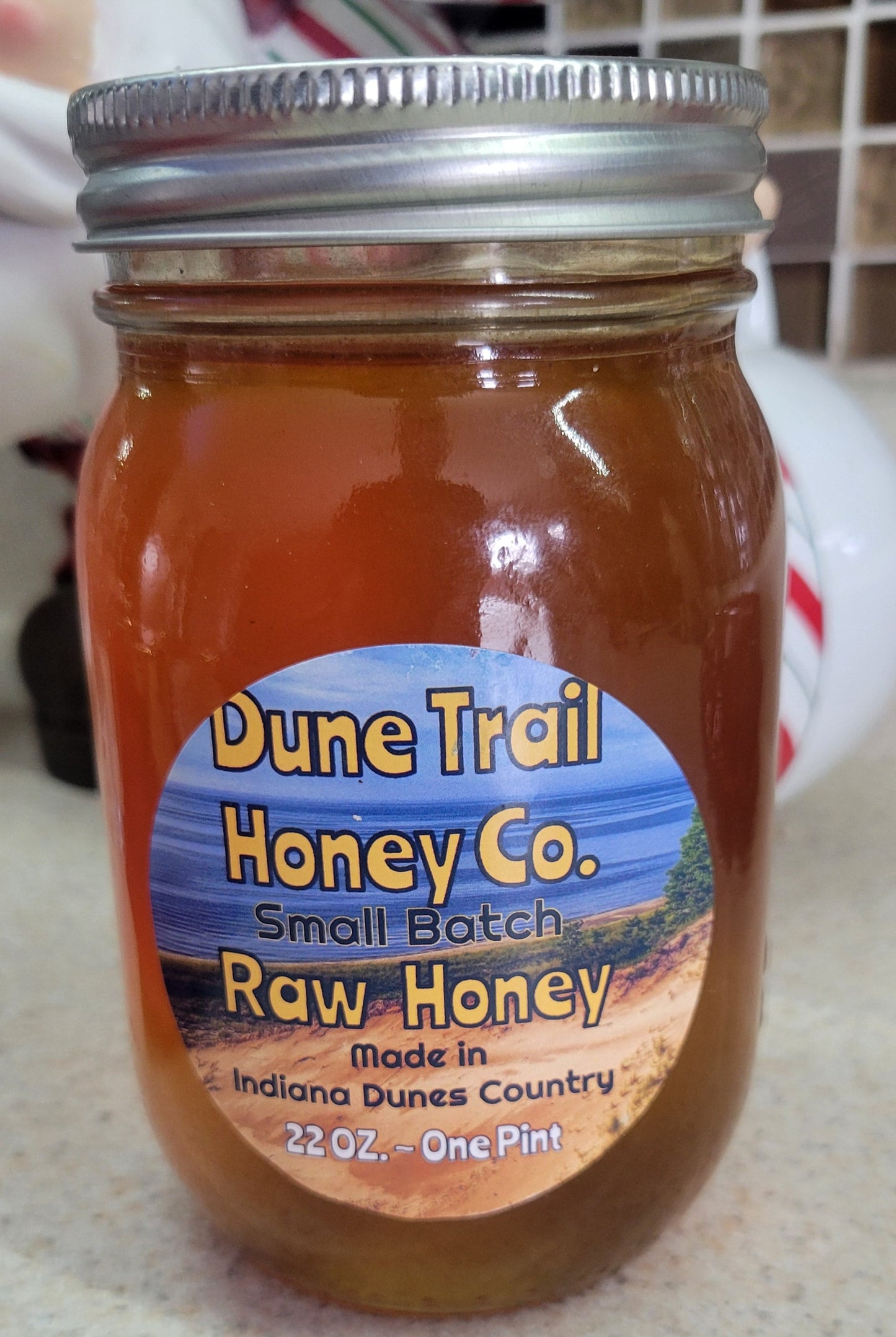 Pint glass jar of our Summer Raw Honey  22 oz