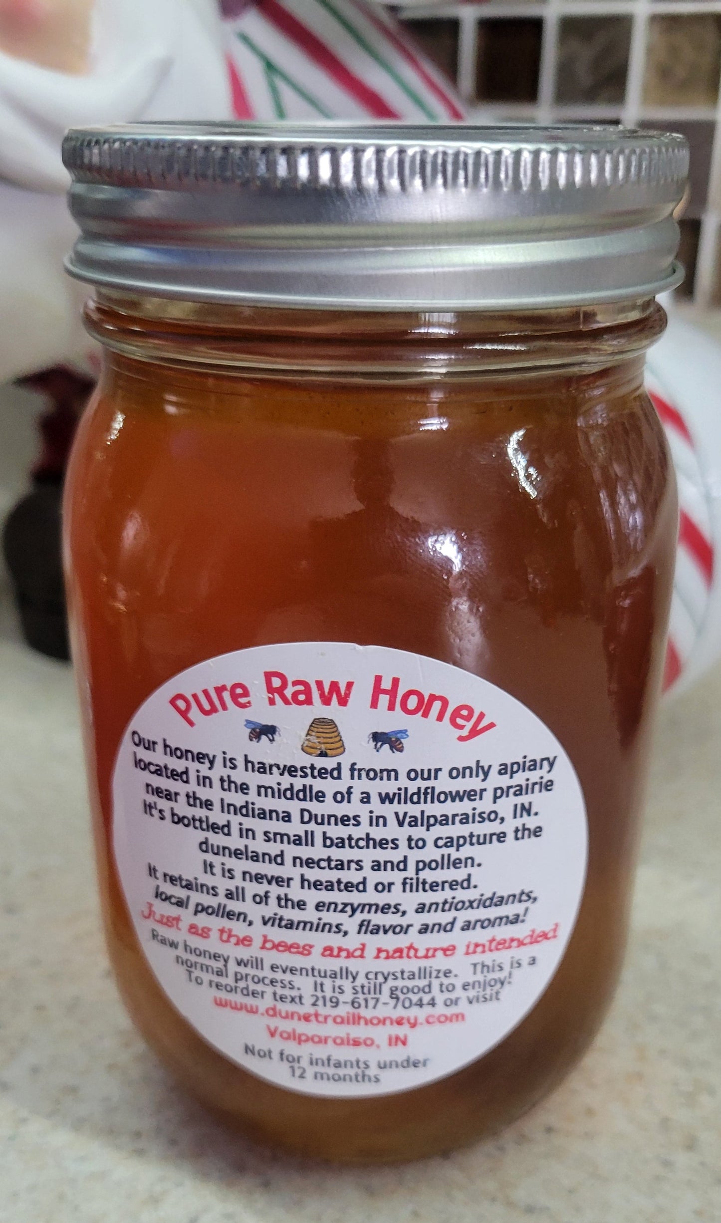 Pint glass jar of our Summer Raw Honey  22 oz