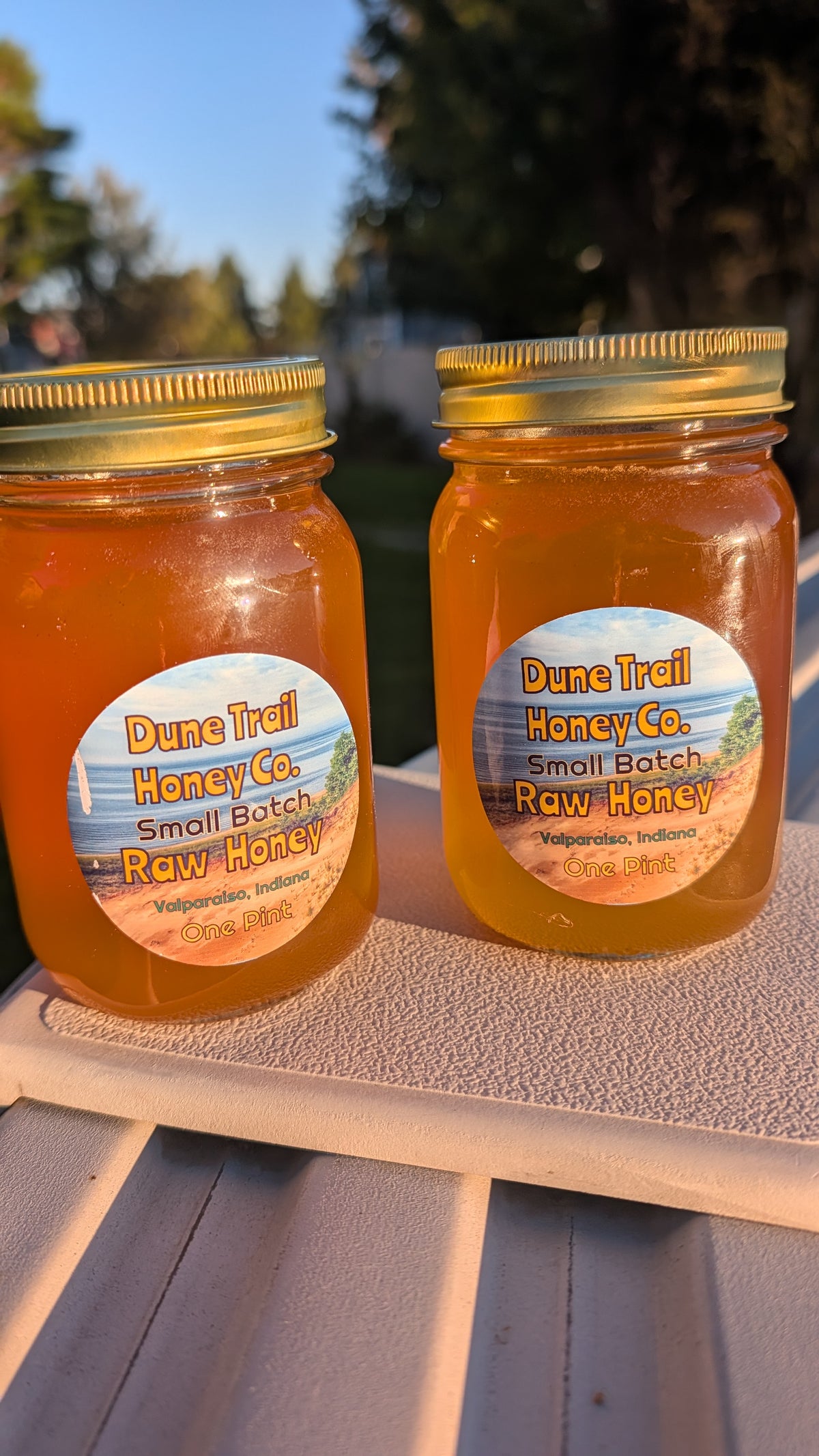 Pint glass jar of our Summer Raw Honey  22 oz