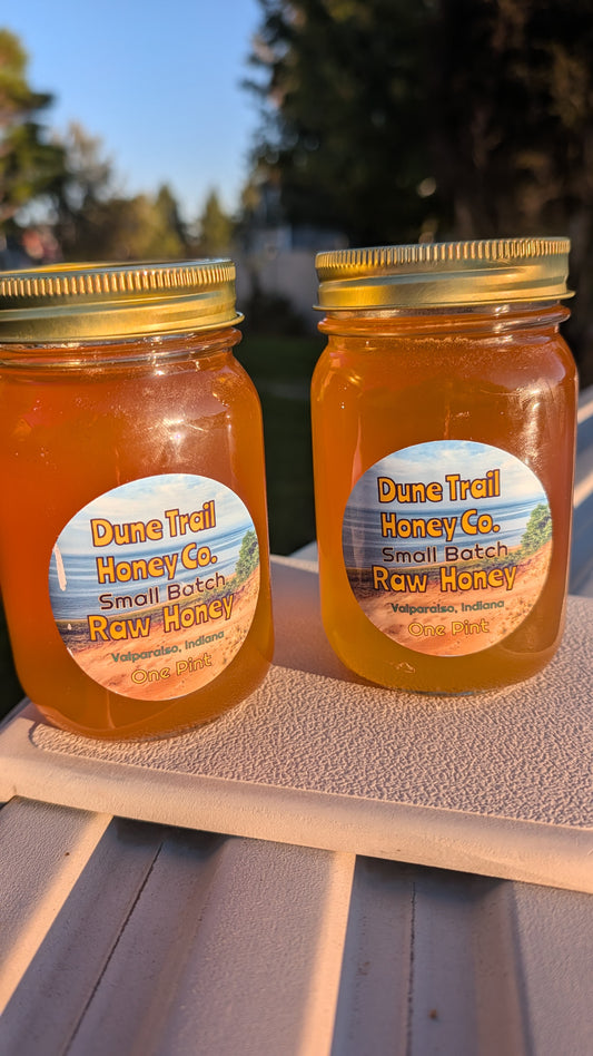 Pint glass jar of our Summer Raw Honey  22 oz
